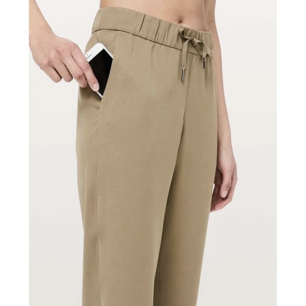 Lululemon‎ On The Fly Crop Pants Size 10 Khaki Woven Drawstring Stretch Casual